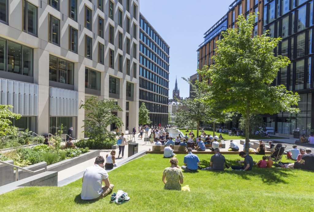 People sitting on a sunny lunchtime in Pancras Square, King's Cross